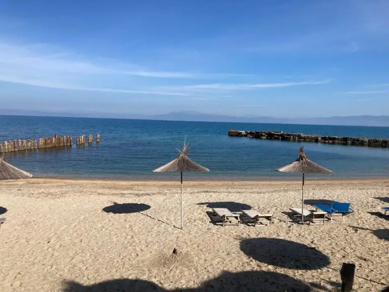 Albanian beach with sea, sand and umbrellas